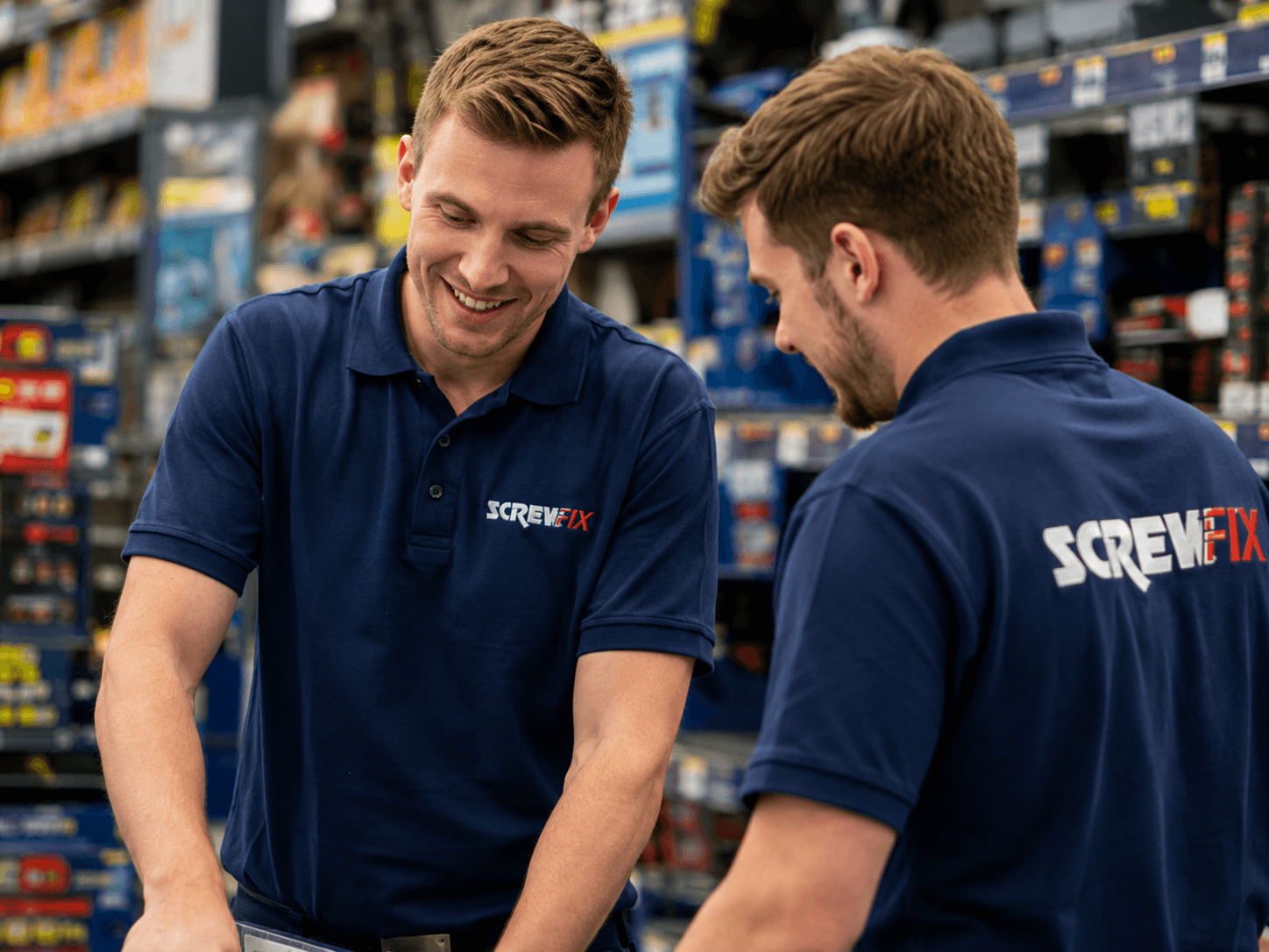 Screwfix colleagues working together in store